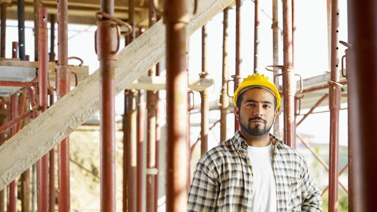 Portrait of latin american construction worker looking at camera